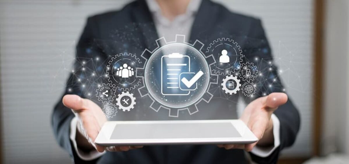 person holding ipad with business process graphic
