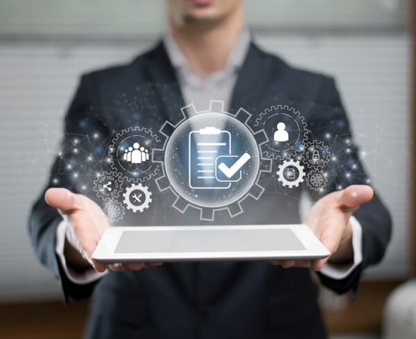 person holding ipad with business process graphic