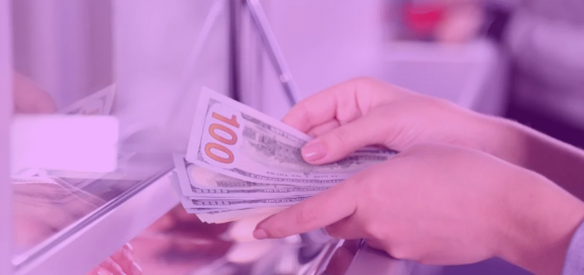 bank teller handing cash