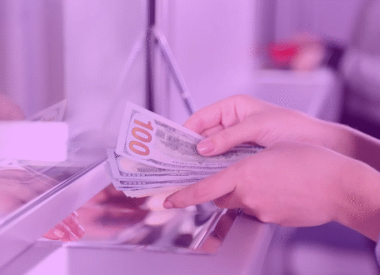 bank teller handing cash