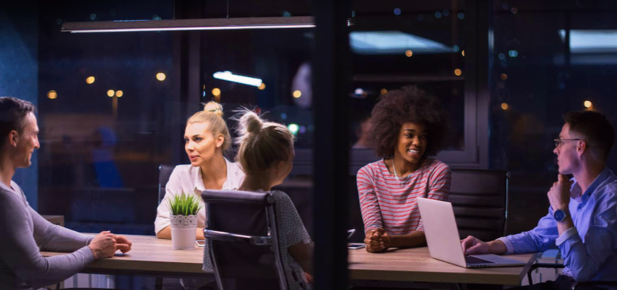 people in an office at night