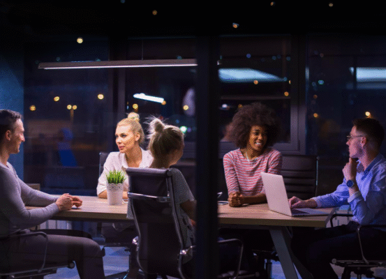 people in an office at night