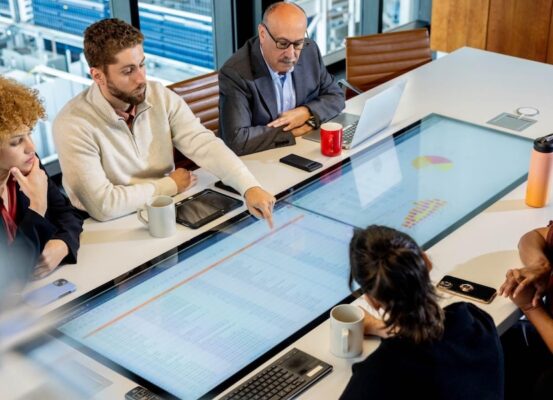 coworkers strategizing around a table