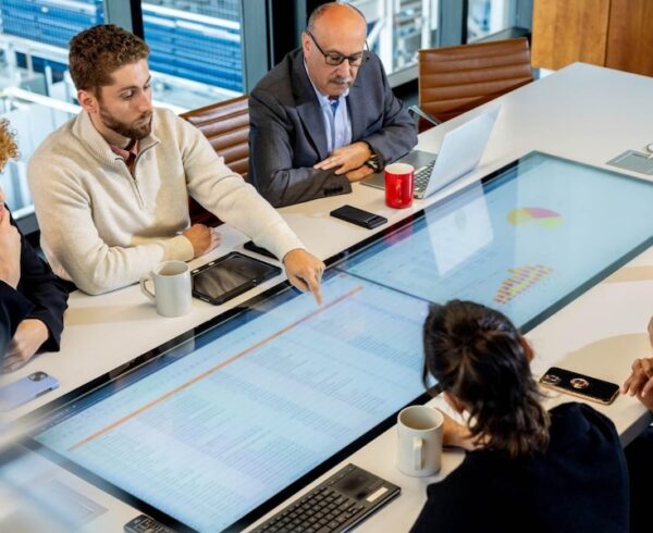 coworkers strategizing around a table